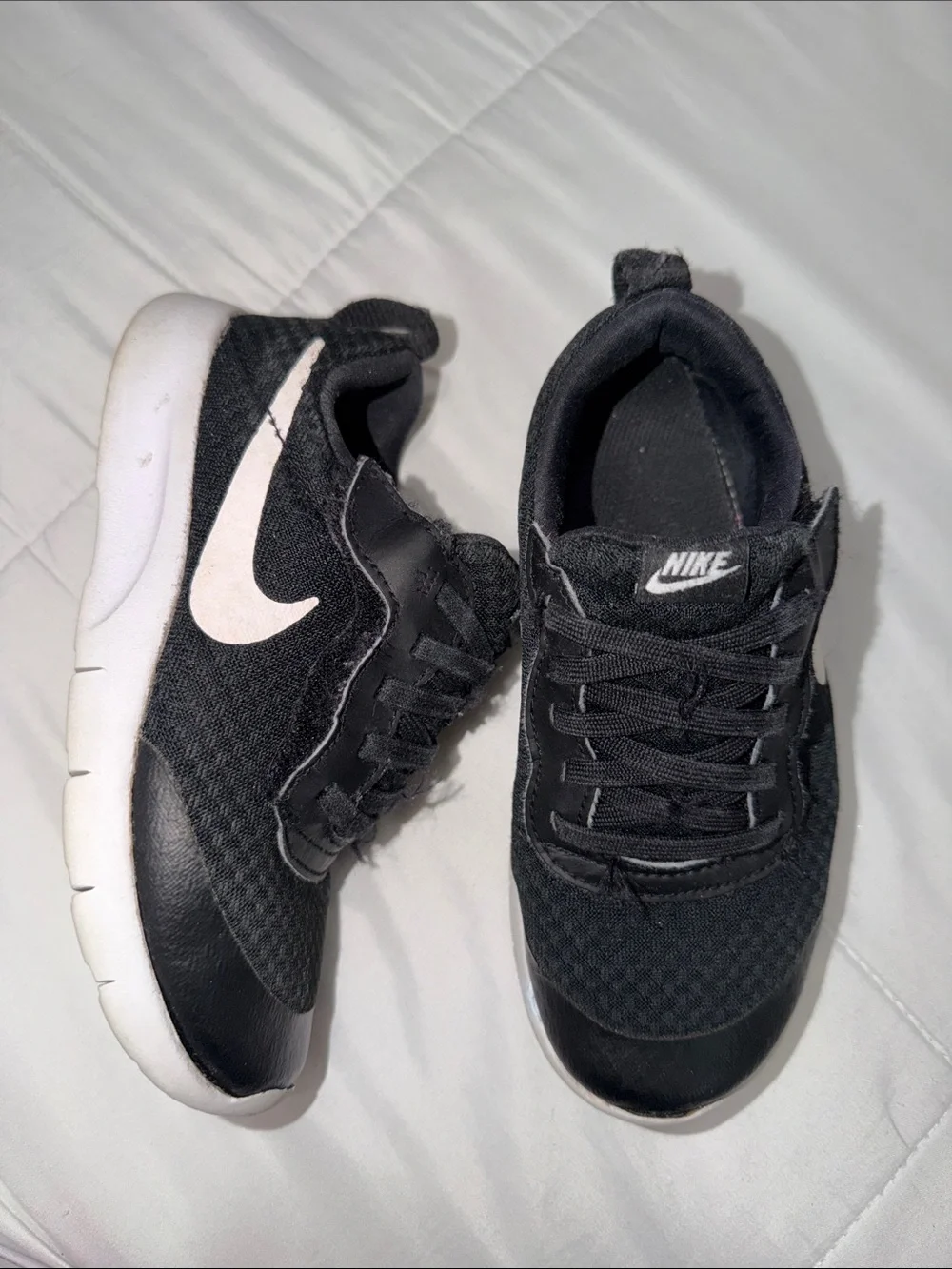 Nike Kids Black Sneakers with White Swoosh